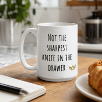 “Not the Sharpest Knife in the Drawer” Meme Ceramic Mug White
